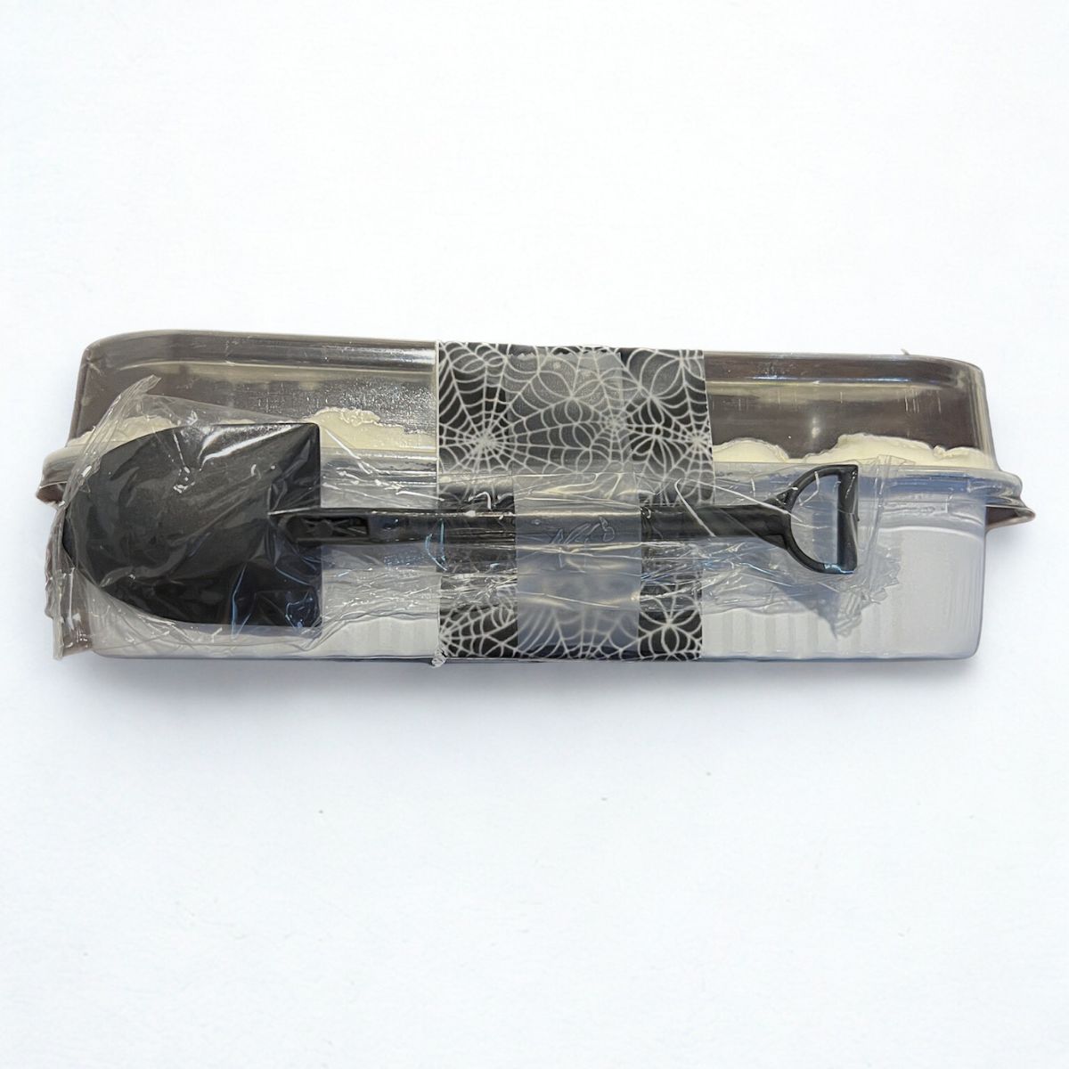 Clear plastic container with black lid and handle on a white background
