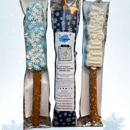 Two chocolate-covered pretzel rods in packaging with a visible brand label on a light blue background.