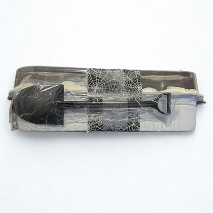 Clear plastic container with black lid and handle on a white background