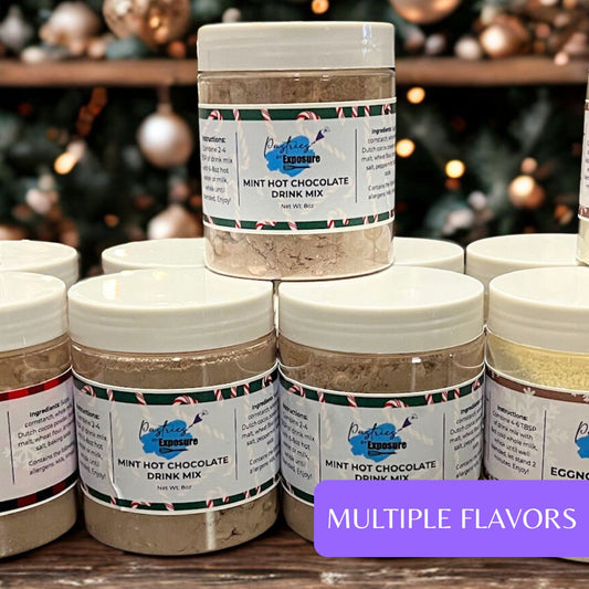Jars of mint hot chocolate drink mix with a blurred Christmas tree background